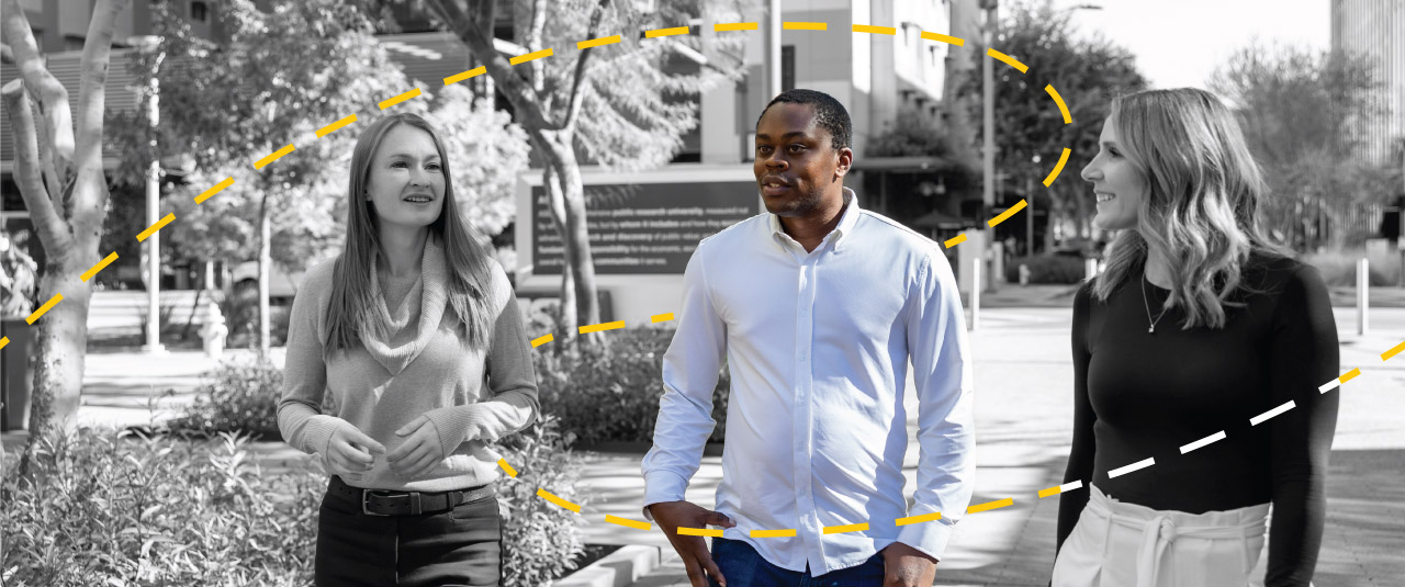 Students and supervisor walking on campus