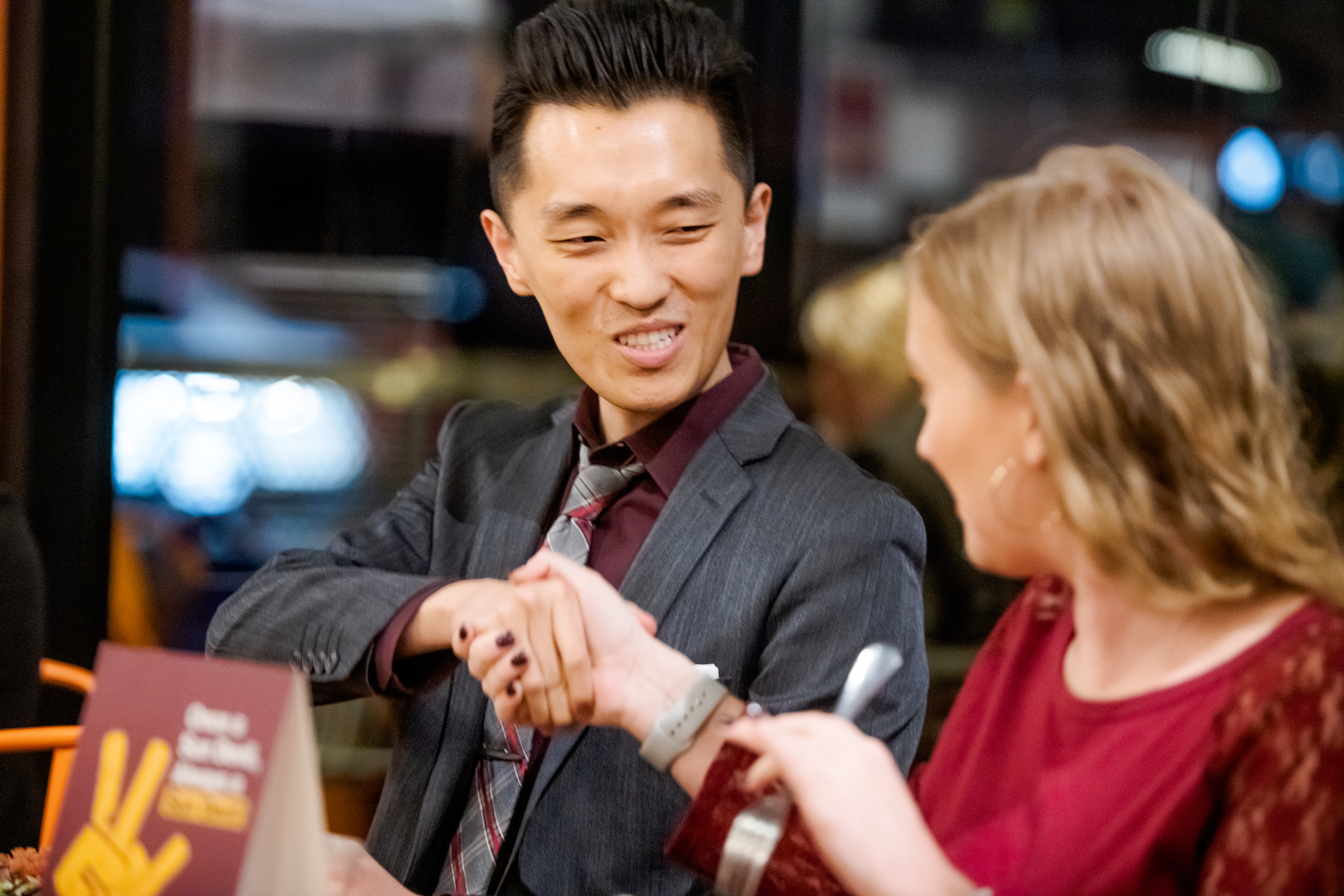 two students shaking hands