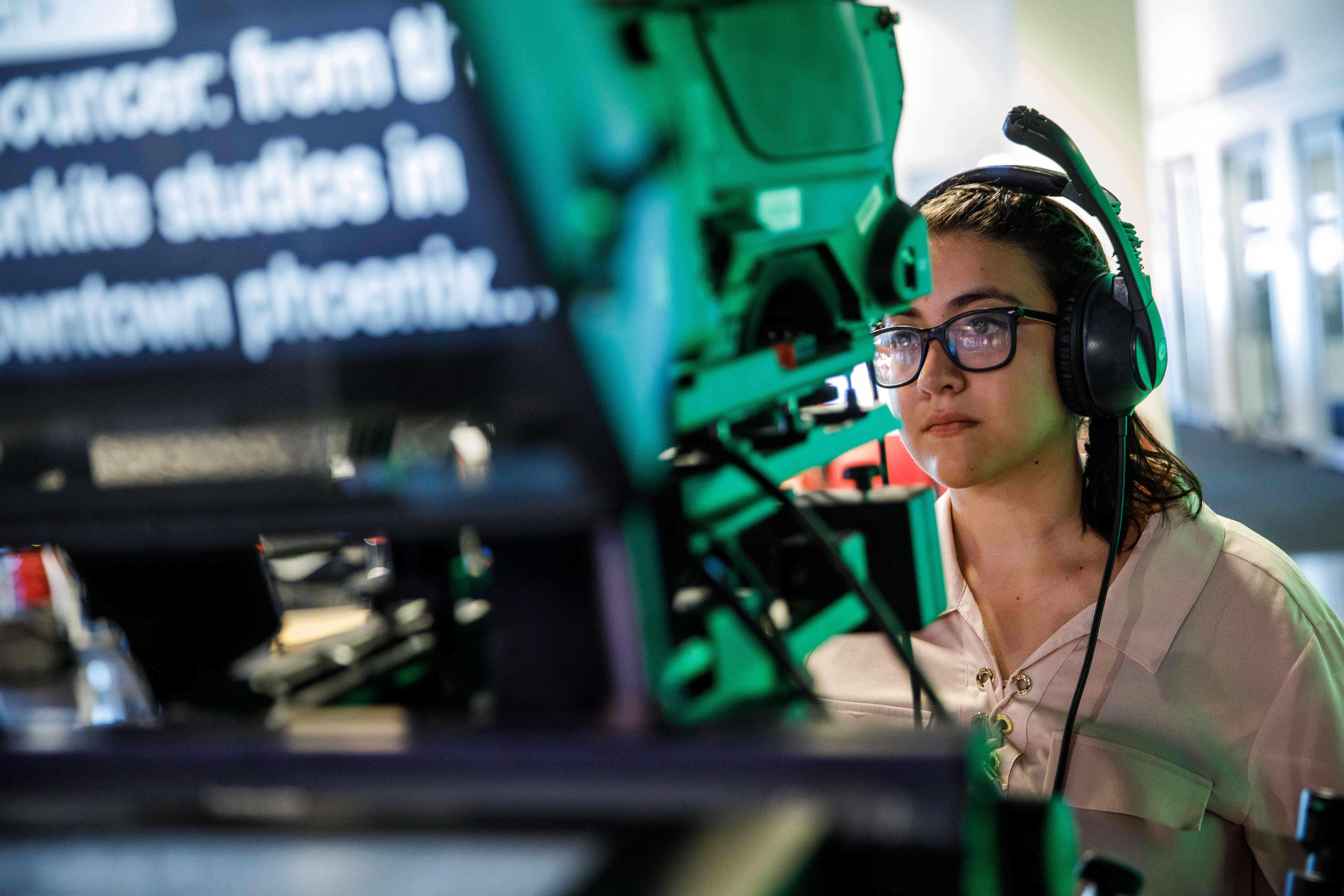 Student at a teleprompter