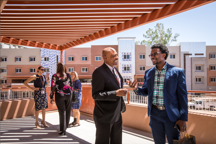 5 adults interacting on ASU campus