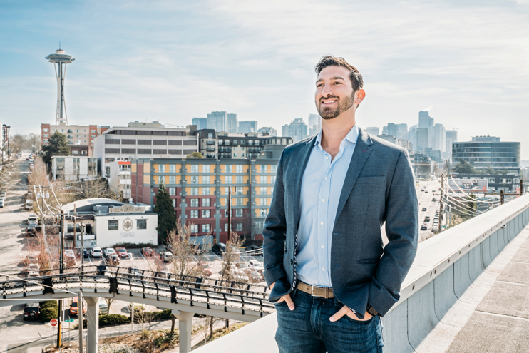 Man in front of buildings