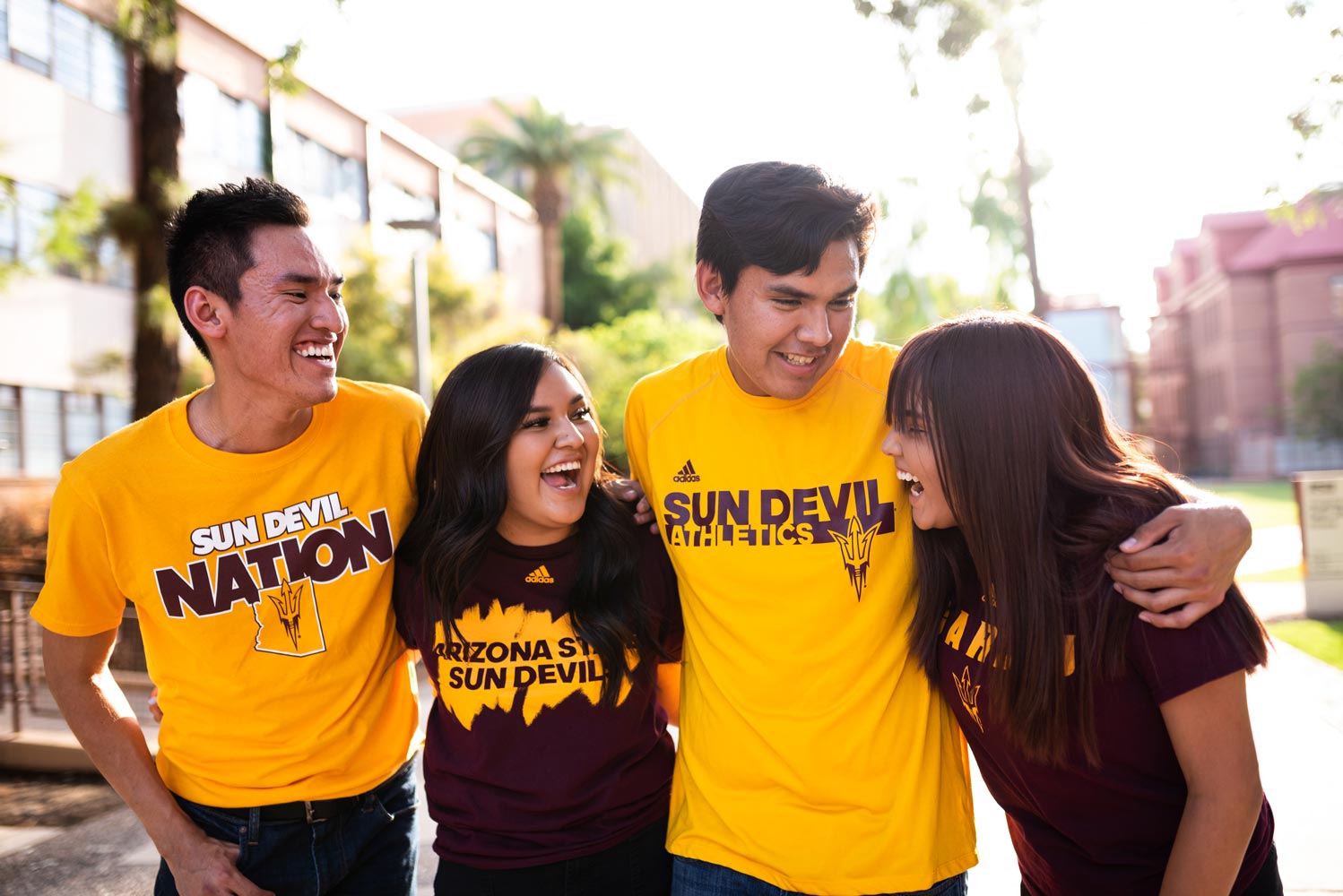 Four students laughing