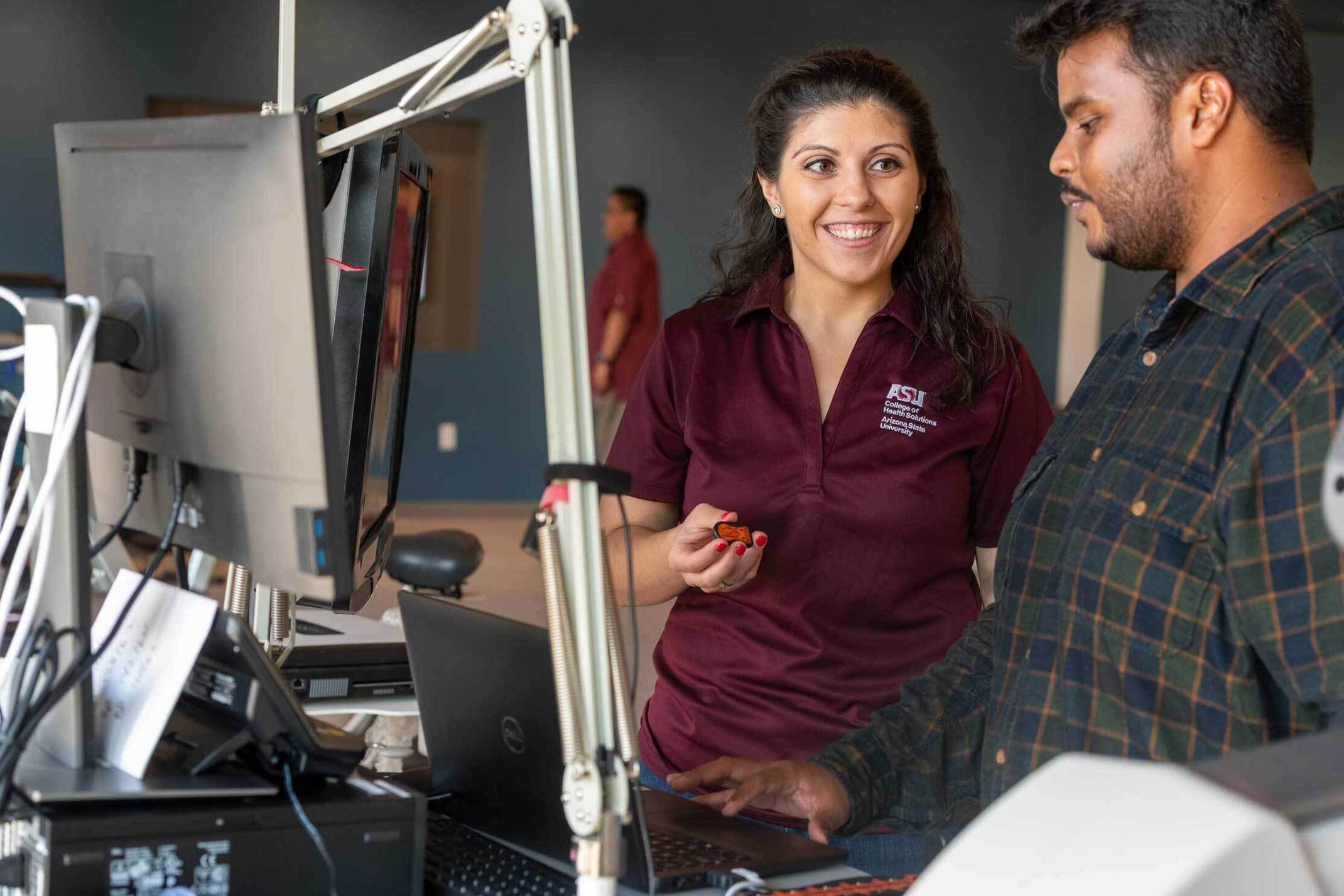 Two people taking with computer