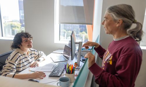 Supervisors talking in office