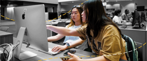 2 students working on a computer