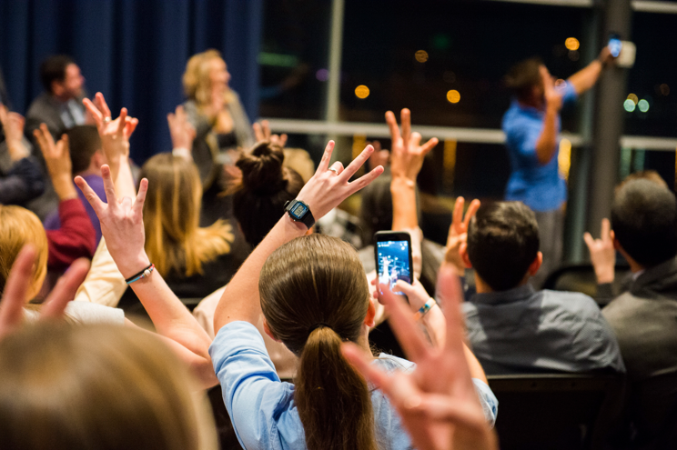 students showing the ASU hand pitchfork